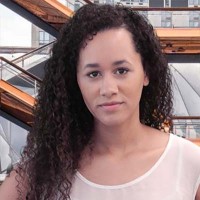 Cherie Atkinson Striking young woman with long dark curly hair